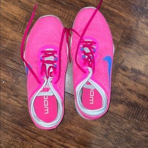 Pink and purple Nike shoes